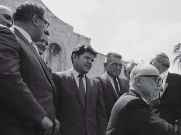 Several men gathered to sign legislation at the Alamo in 1969