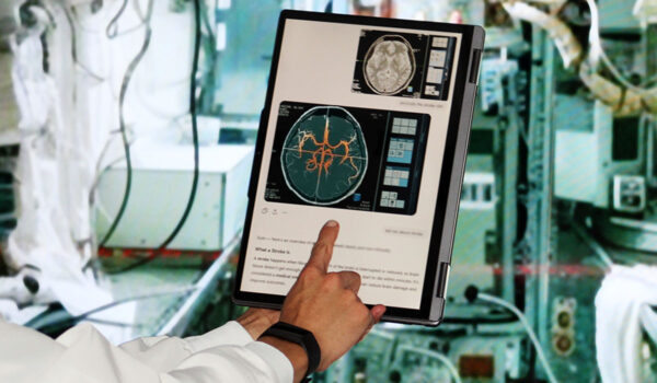 A person points to a brain scan on a tablet screen in a space habitat