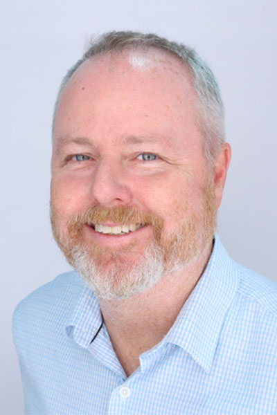 Headshot of Eric Brey