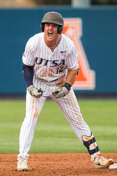 Drew Detlefsen shouts enthusiastically while standing on second base.