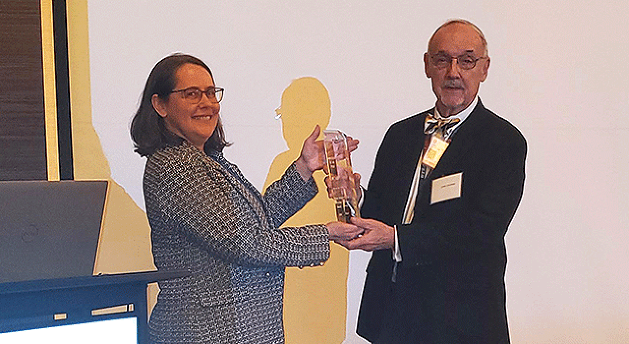 Christine Burke presented James Chambers with the Innovator of the Year award at the ceremony for UTSA’s 2024 Innovation Awards.