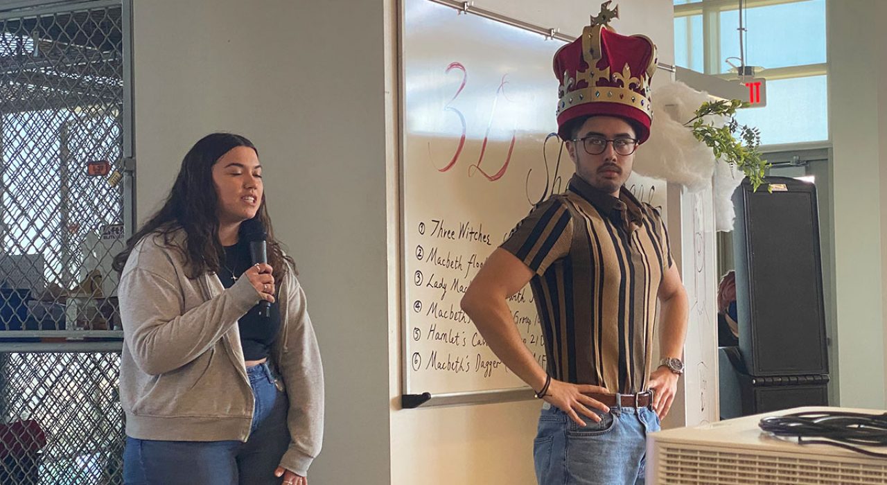 3D-shakespeare-2 A male student wears a 3D-printed crown while a female student discusses the process of making it