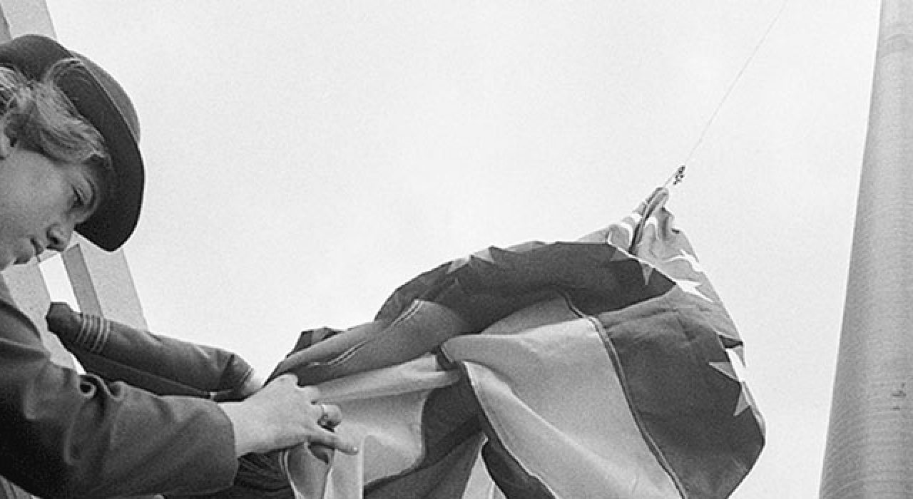 ROTC cadets participate in ceremony that sees flags fly over the new campus for the first time.