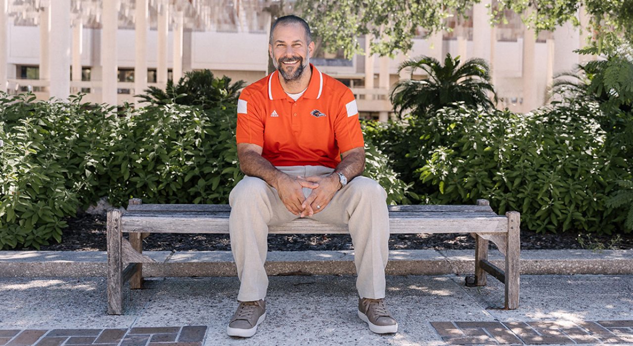professor dan karam sitting on bench