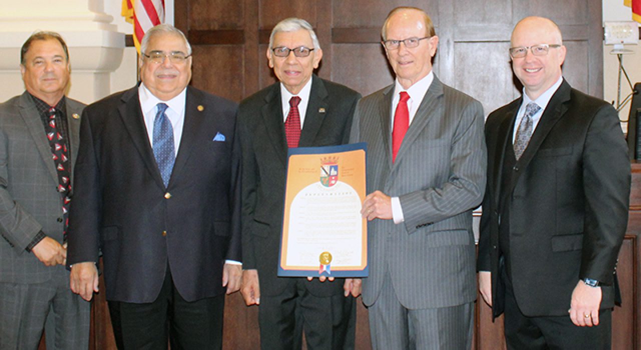 Valdez (center) with Judge Nelson Wolff and Bexar County Commissioners