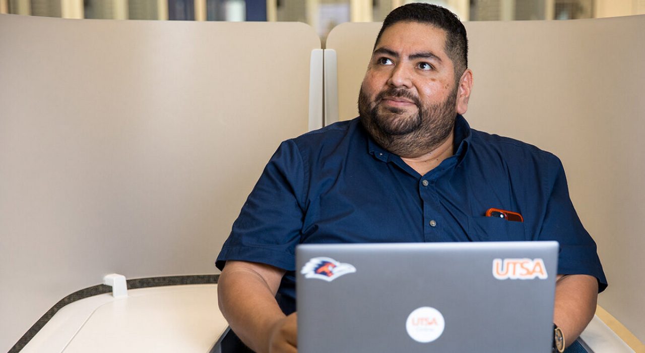 student roger ruiz with his laptop