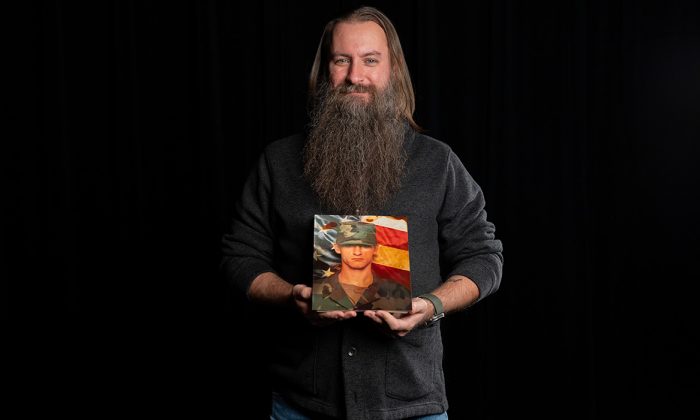 William Lansdon holding a portrait of himself