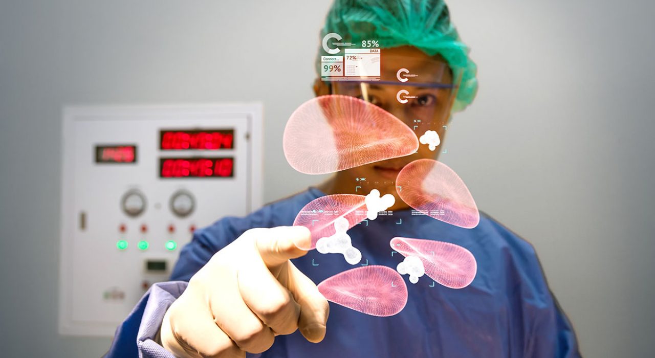 A surgeon points to illustrated holograms of cells