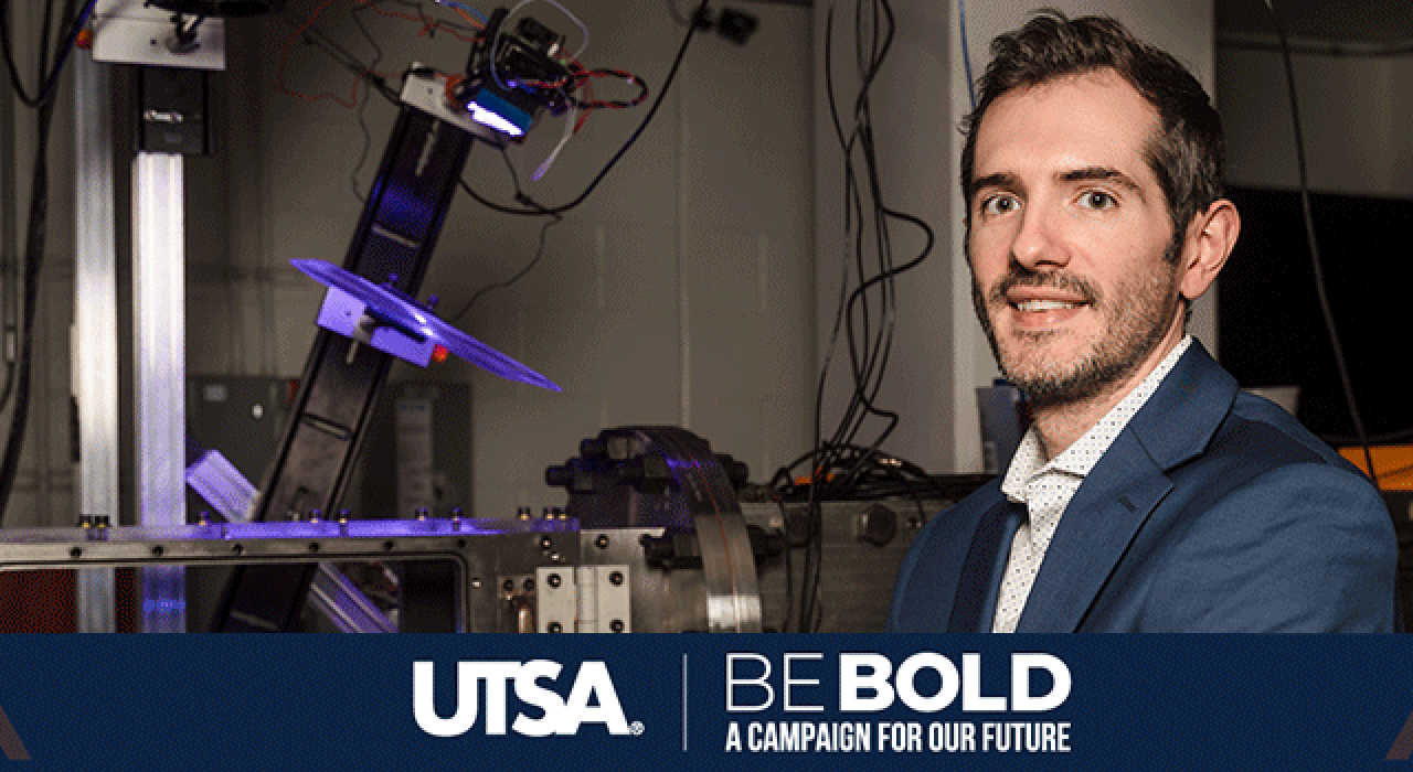 Chris Combs works with students in the Hypersonics Lab.