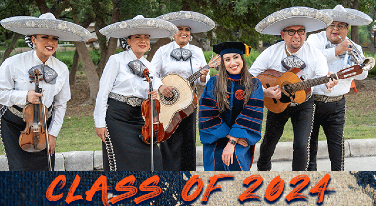 This student crossing the stage exhibits the gold cord that signifies graduation with honors and the tri-colored tassel that signifies he has earned a bachelor’s degree.