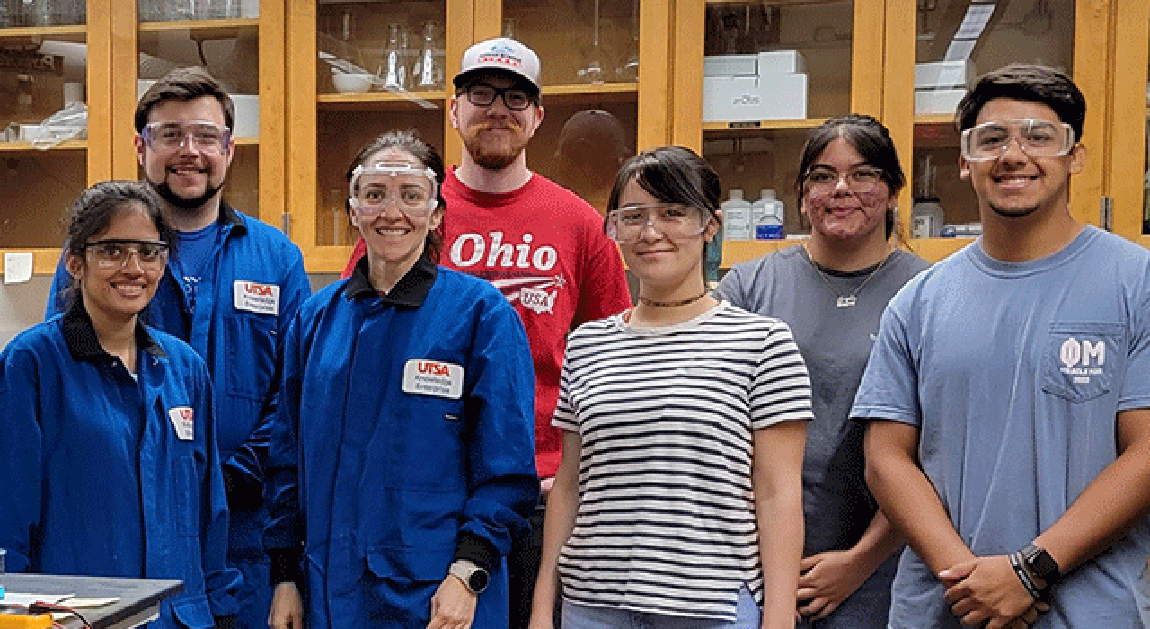 Professor Brendy Rincon Troconis (third from left) joins students in the UTSA Corrosion Research Laboratory.