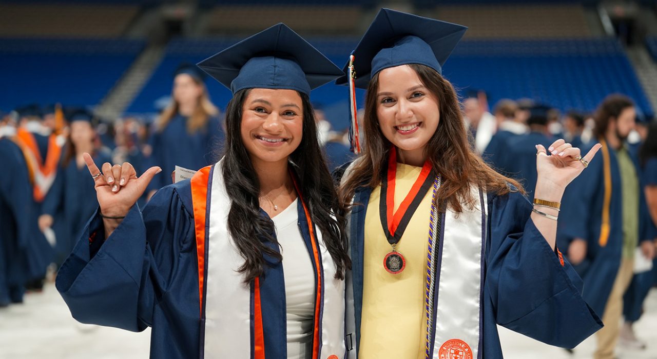 two students at graduation