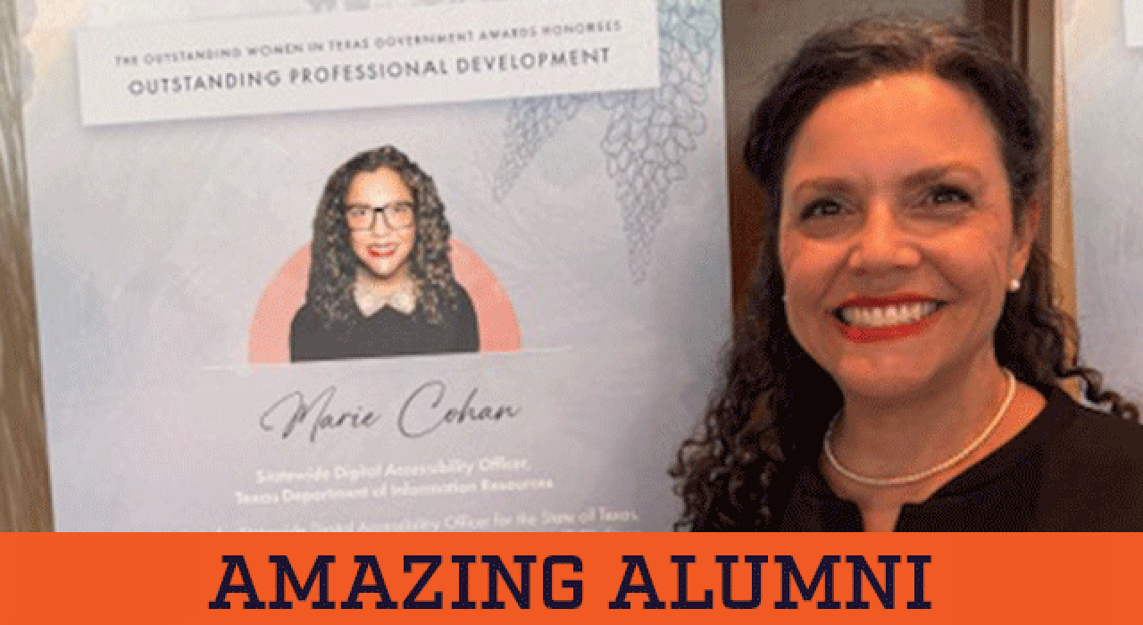 Marie Cohan ’92 poses in front of a poster at an event where she was honored with the Outstanding Women in Texas Government Professional Development Award.