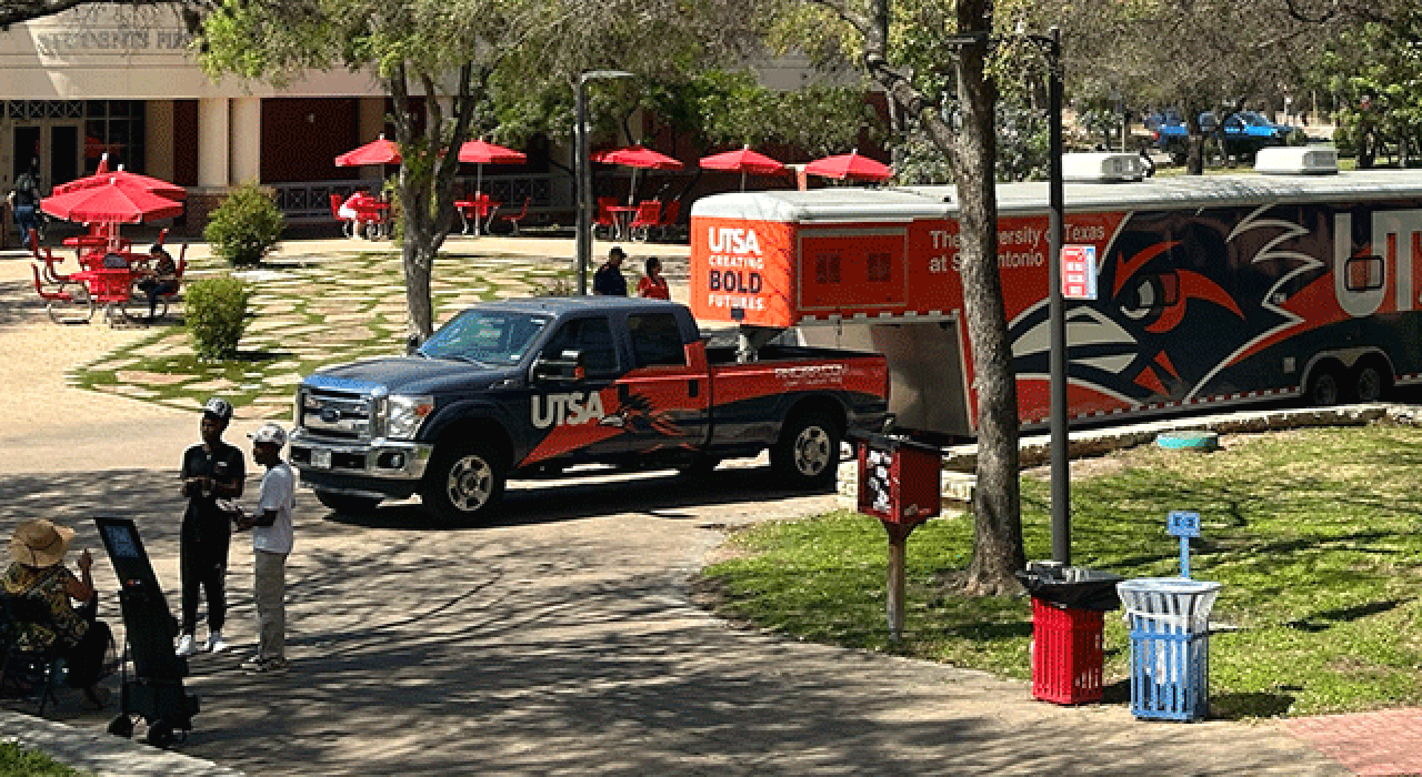 Prospective college students fill out their applications from UTSA's new Mobile Go Center.