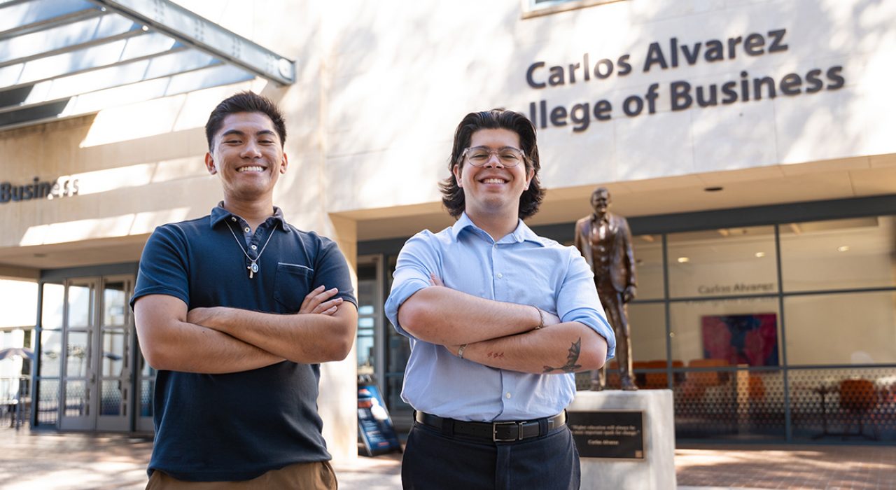 drum majors and students in front of ut san antonio business building