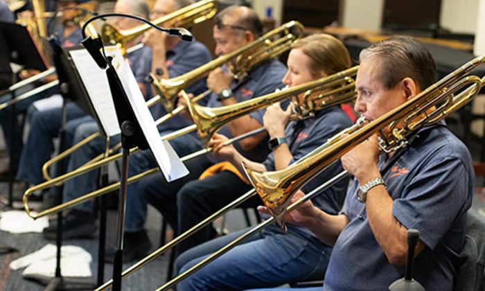 The On-Corps band boasts 80 members, including these trombone players.