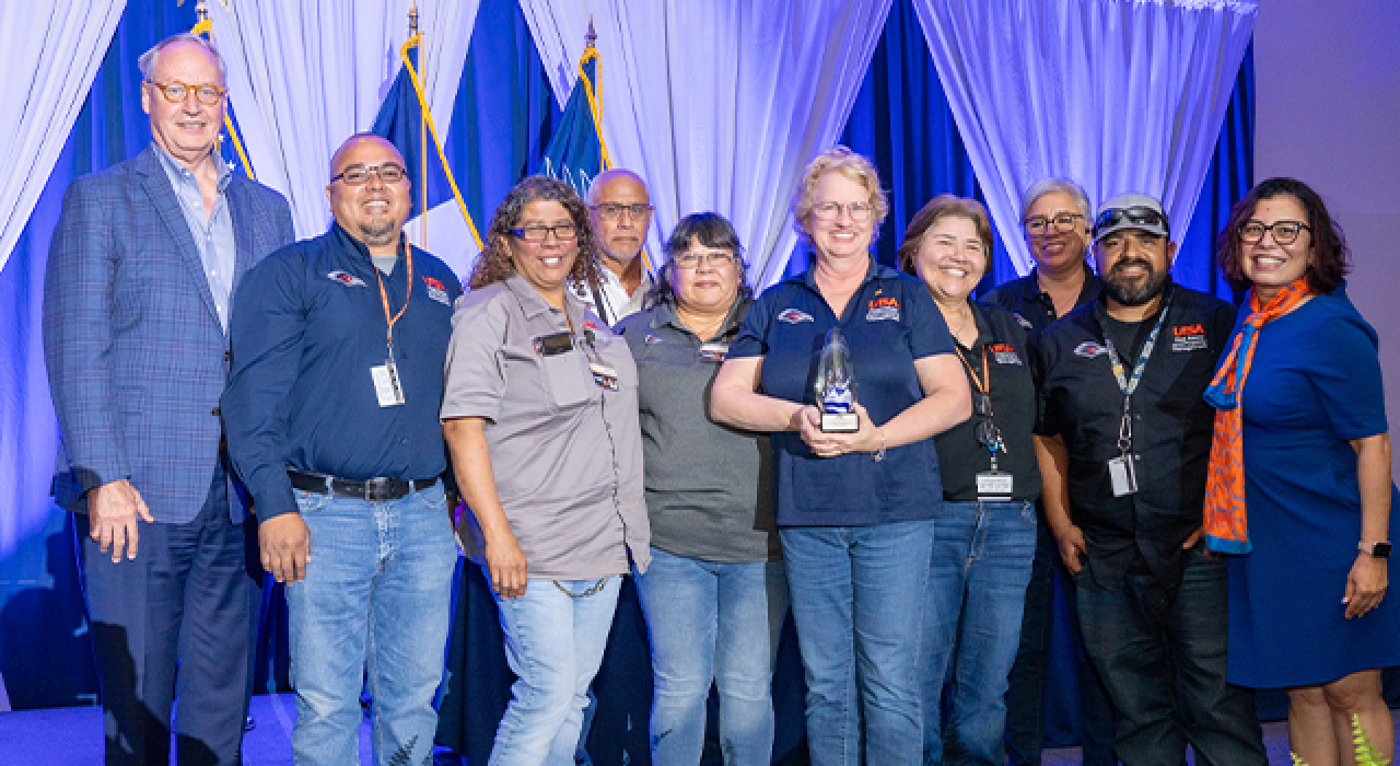 Members of the UTSA Custodial & Grounds Contract Transition team pose with President Taylor Eighmy and Veronica Salazar
