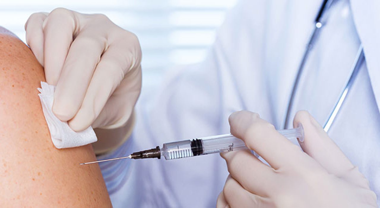 A Roadrunner receives a COVID-19 vaccine at a campus clinic.
